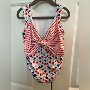 James & Lottie swim suit GUC size 5   The bow is on the back of the suit